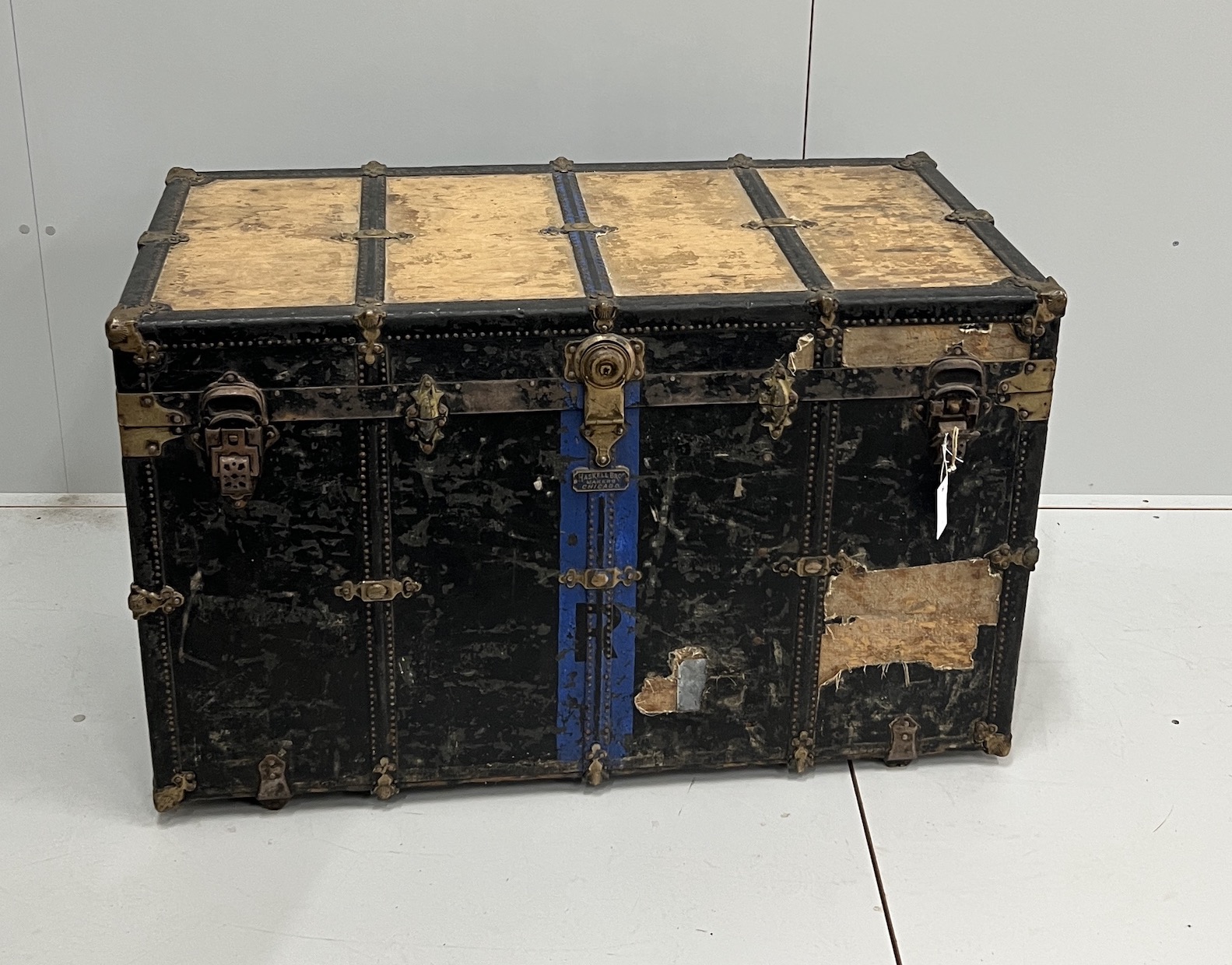 A late 19th century American travelling trunk by Haskell Brothers, Chicago, width 106cm, depth 54cm, height 67cm